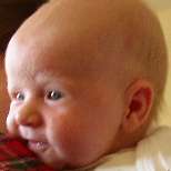 Cormac smiling over Mary's shoulder