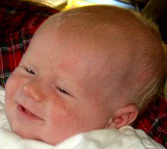 Mary holding a smiling Cormac